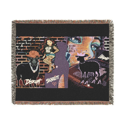 Woven blanket with artistic design featuring animals and text on a black background